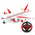 Red and white ground-running RC passenger aeroplane with steering-wheel remote on a white background
