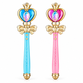 Pink and blue princess magic wand toys with LED lights on white background